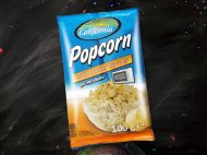 Popcorn do mikrofali o smaku maślany , cena 1,29 PLN za 100 g/1 opak.